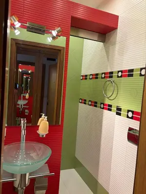 a bathroom with a sink and a mirror at City Sunrise in Sofia