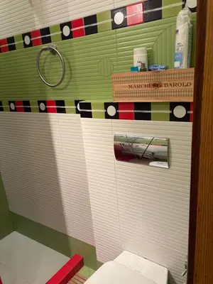 a bathroom with a toilet with blinds on it at City Sunrise in Sofia
