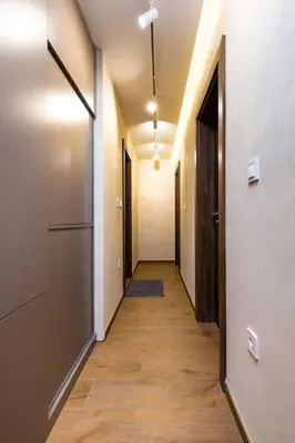 a hallway of an empty room with doors and a hallwayngthngthngthngthngth at Central Victoria Home 2-bedroom apt in Plovdiv
