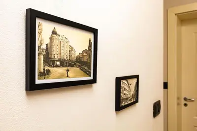 a framed picture of a city on a wall at La Primavera Spacious Apartment in Plovdiv