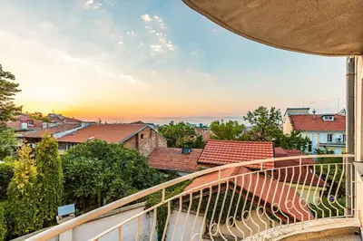 a balcony with a view of a city at La Primavera Spacious Apartment in Plovdiv