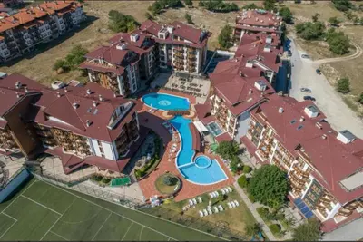 an aerial view of a large house with a swimming pool at lux apartament К602 in Bansko