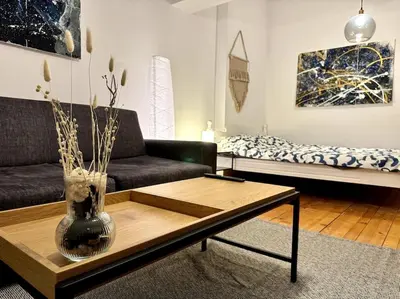 a living room with a couch and a coffee table at Sofia Sweet Spot: Central & Cozy in Sofia