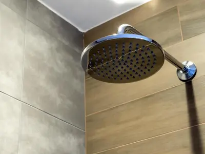 a shower head on a wall in a bathroom at Hotel Calipso Hotel in Sofia