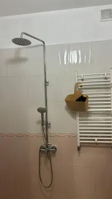 a shower in a bathroom with a shower head at Quiet 2 bedrooms downtown apart in Sofia