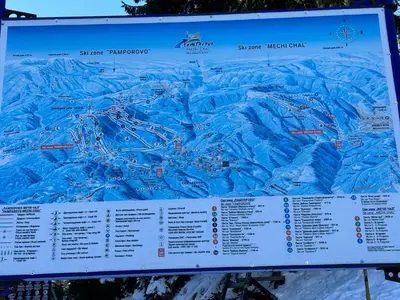 a sign for a ski resort with a map at The Castle Mountain Apartments in Pamporovo