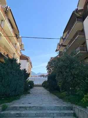 a cobblestone street between two buildings with acean at Cozy nature stay, free Bottle of good Wine, Great view, free Parking in Bansko
