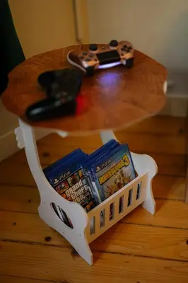 a table with a shelf of video games and a guitar at 2 Designer Apartments Seconds Away From Тhe Main Street, FREE Parking in Sofia