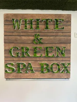 a sign that reads wirt and green spa box at WhiteBoxApartment in Kyustendil