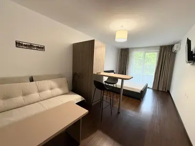 a living room with a couch and a table at Terra apartment in Sandanski