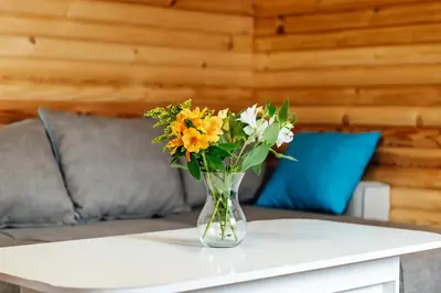 a vase of flowers sitting on a table at Къщи за гости БРИК in Sapareva Banya