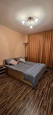 a bedroom with a large bed in a room at РЕЛАКС - апартамент 1 in Chepelare
