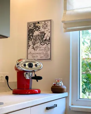 a red robot sitting on top of a kitchen counter at Este Apart Historical Center in Sofia