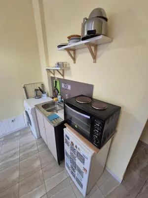 a kitchen with a microwave and a sink at Private stay place in Sofia