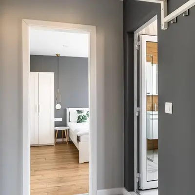 a room with a bed and a door leading to a bedroom at The House-Kamenitza Апартамент и релакс зона in Velingrad