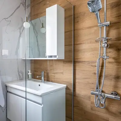 a bathroom with a sink and a shower at The House-Kamenitza Апартамент и релакс зона in Velingrad