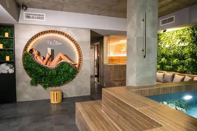 a bathroom with a swimming pool and a mirror at The House-Kamenitza Апартамент и релакс зона in Velingrad