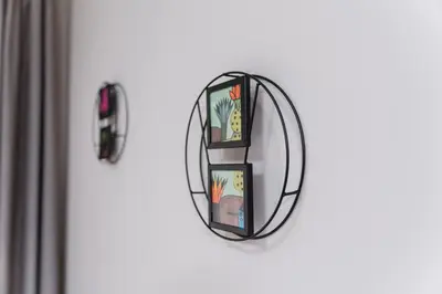 a mirror hanging on a wall next to a door at Cozy 2-bed Apartment in Plovdiv