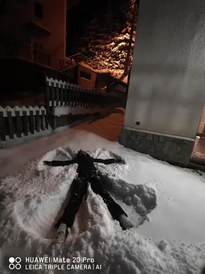 a pile of snow in front of a fireplace at Вила 5 - Планински перли in Stoykite