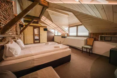 a bedroom with two large beds in a room at Лондонъ - къща за гости / London - guest house in Kyustendil