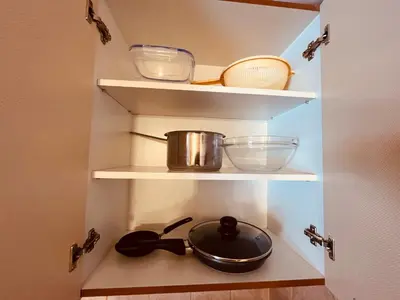a kitchen shelf with a pot and a pan on it at Marina Apartment - Mountain View in Bansko