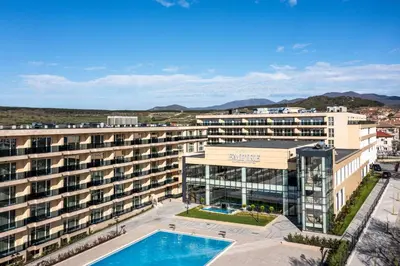 an aerial view of a building with a swimming pool at Empire Balneo & Spa Hotel in Hisarya