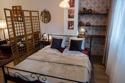 a bedroom with a bed with two pillows at SOTS apART in Sofia center in Sofia