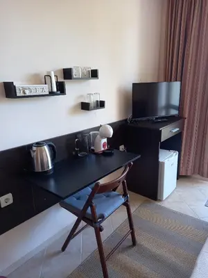 a black desk with a chair in a room at Panorama Stoykite Eurydice in Stoykite