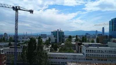 a view of a city with a construction crane at Modern Comfort near Airport, The Mall, TechPark by KeyBox in Sofia