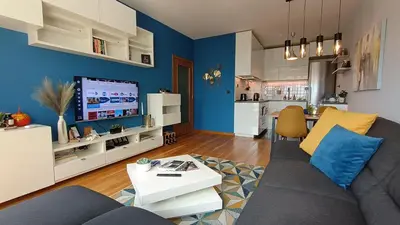 a living room with a couch and a table at Modern Comfort near Airport, The Mall, TechPark by KeyBox in Sofia