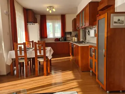 a kitchen with a table and a kitchen with a dining room at Spacious 2 Bedroom Apartment in Sofia