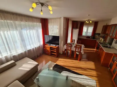 a living room with a couch and a table at Spacious 2 Bedroom Apartment in Sofia