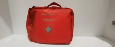 a red bag sitting on a table in a room at Apart Hotel Roma in Sofia