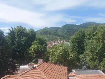 a view of a town with mountains in the background at Апартамент за гости Асеновец in Asenovgrad