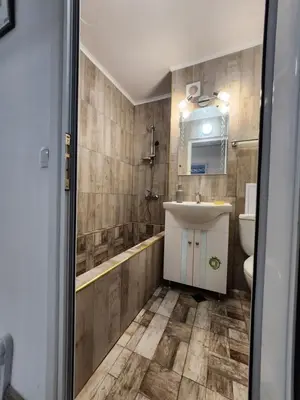 a bathroom with a sink and a toilet at luxury two bedroom Crown Apartament in Pravets