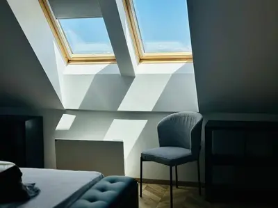 a bedroom with a window and a chair and a bed at 15% Discount! Limited Time in Sofia
