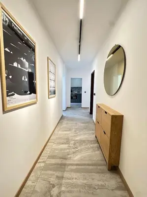 a hallway with a dresser and a mirror on a wall at 15% Discount! Limited Time in Sofia