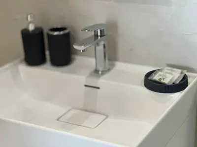 a bathroom sink with a faucet and a soap holder at 15% Discount! Limited Time in Sofia