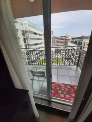 a balcony with a view of a balcony with a table at New Two Bedroom apartment with balcony in Sofia