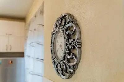 a clock on the side of a wall at Elegant 1-Bedroom Apartment in Plovdiv