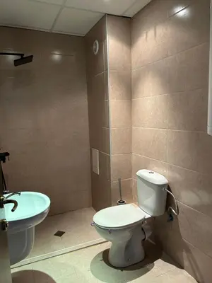 a bathroom with a toilet and a sink at Apartament Armada Bansko in Bansko