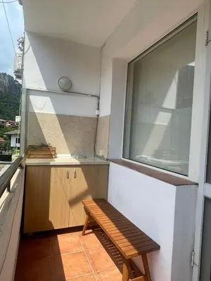 a small balcony with a bench and a window at Apartment Maddie in Teteven