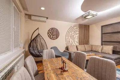 a living room with a table and a couch at Top Center Retreat, Close to Main street, FREE Parking in Sofia