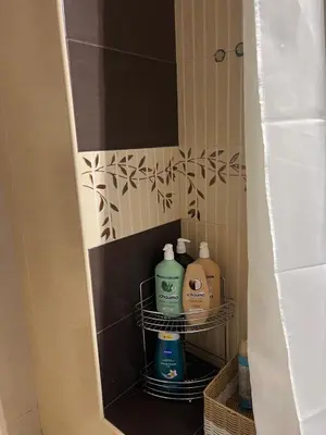 a bathroom with two bottles of soap and a mirror at Brand NEW! 2BDR Lux Apartment RAYKO in Sofia