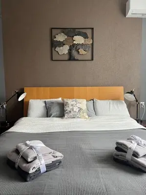 a bedroom with two beds with towels on them at Brand NEW! 2BDR Lux Apartment RAYKO in Sofia