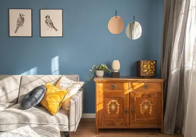a living room with a couch and a wooden cabinet at Cozy Apartment Overlooking The Park in Sofia