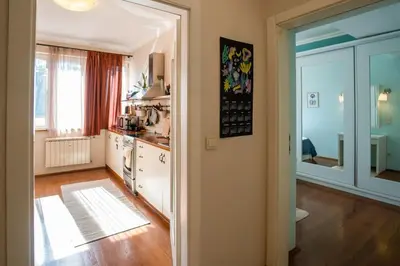 a kitchen with a large glass door leading into a room at Home in Sofia's Beating Heart in Sofia