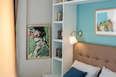 a bedroom with a bed and a book shelf at Home in Sofia's Beating Heart in Sofia