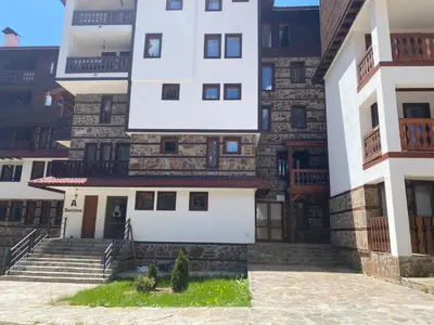 a building with some stairs and a building at Pamporovo mountain apartment in Pamporovo