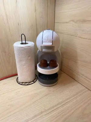 a coffee maker and a roll of paper towels at Pamporovo mountain apartment in Pamporovo